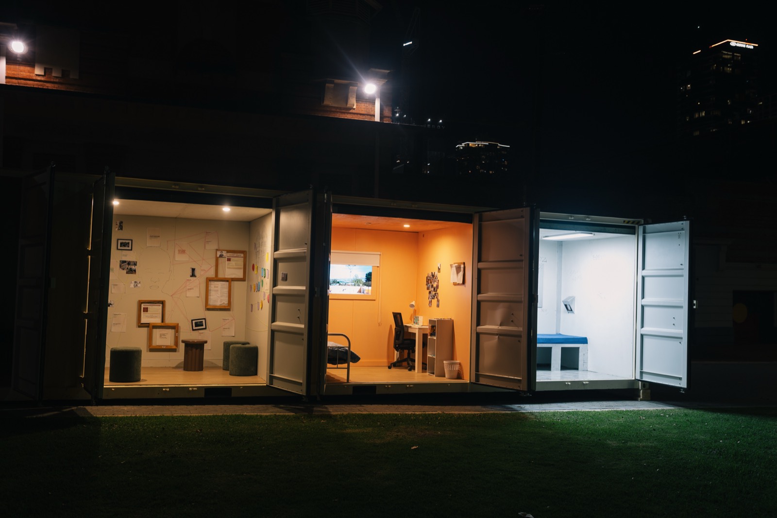 CONTAINED open at night with all three rooms lit